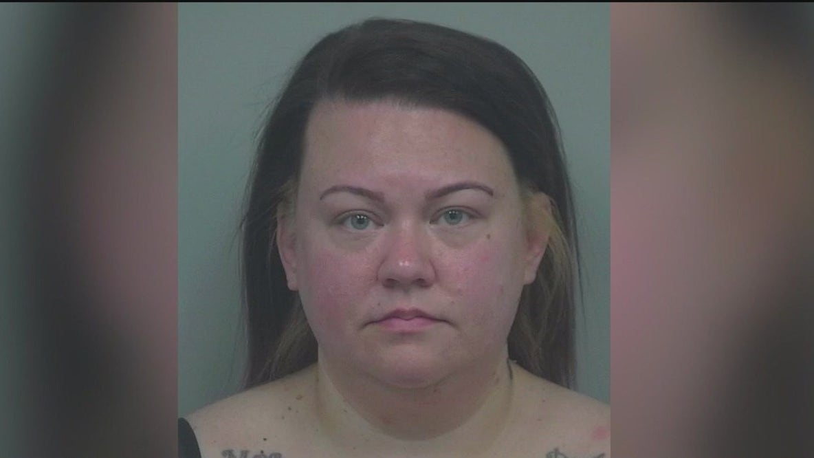 Woman accused of shooting Tesla dealership